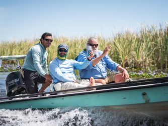 Boat ride on the marsh having a beer and having fun PH River Wizards scaled