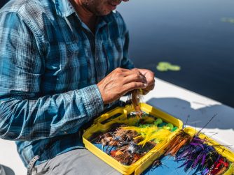 Guide preparing his flies PH River Wizards scaled